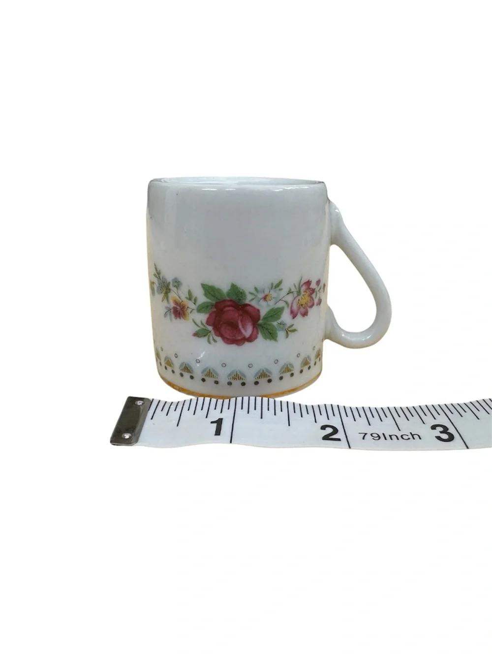 Vintage Espresso Cup and Matching Saucer. White Porcelain with Floral Motif.